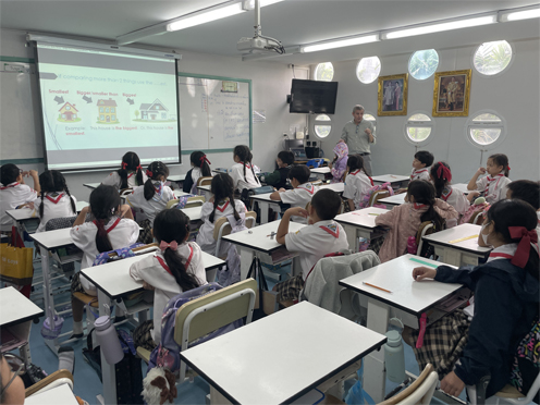 A TEFL classroom in Thailand with a teacher and students learning grammar