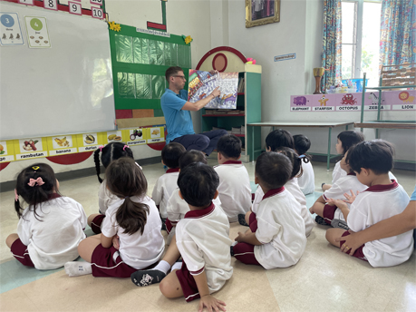 TEFL teacher leading a storytime session in a Thai classroom